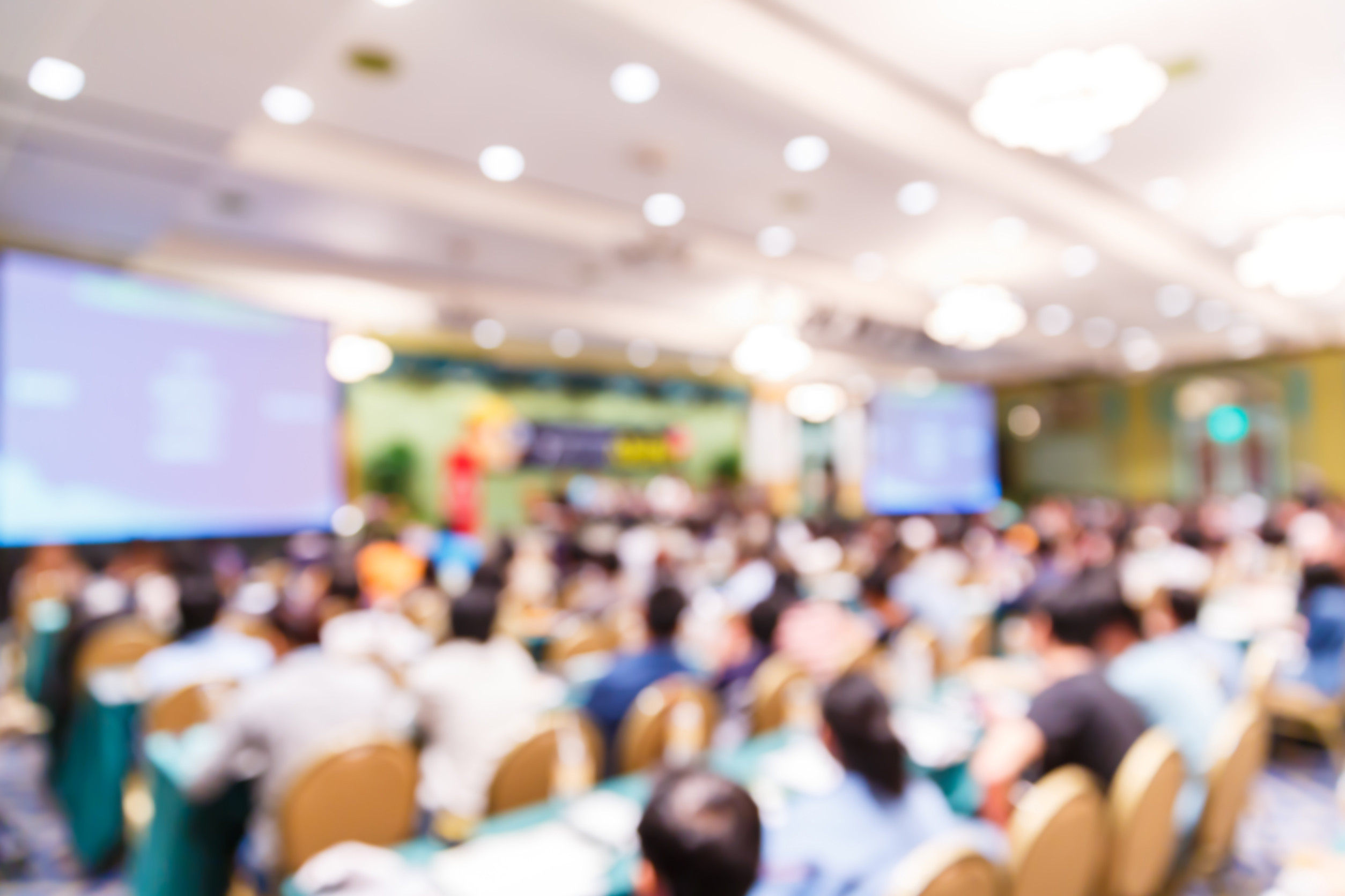 Blurred people in seminar room
